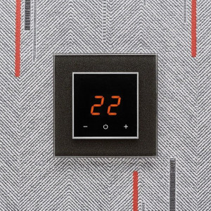 Терморегулятор DeLUMO Orto 0337 сияющий черный на сером фоне