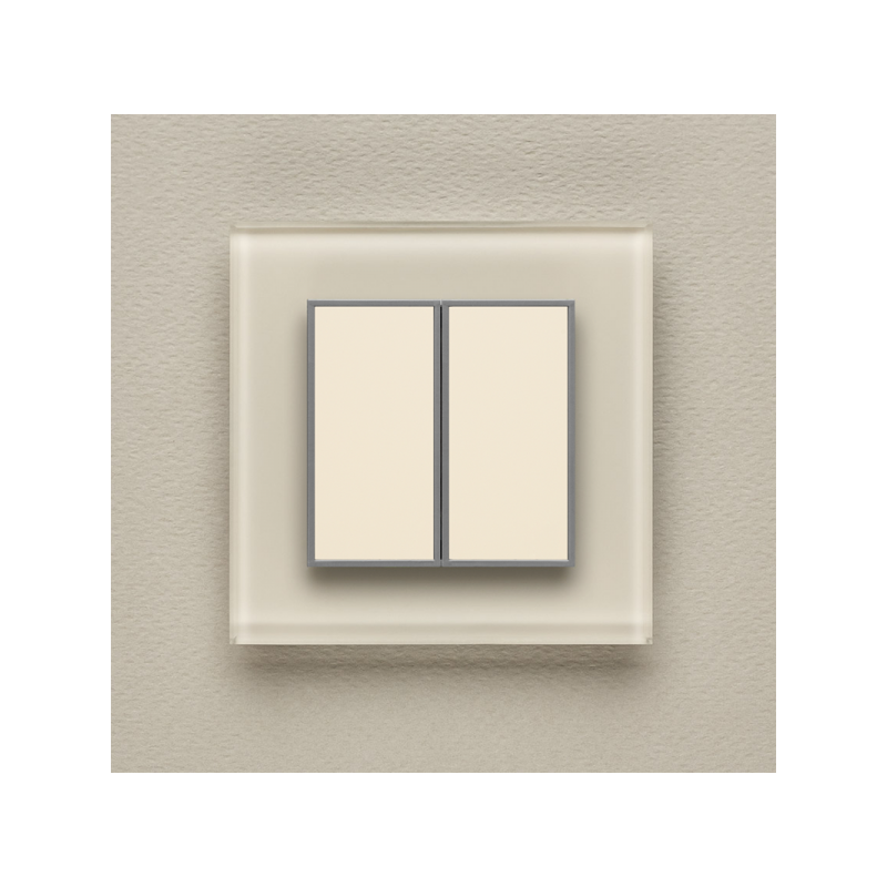 Одноканальный двухклавишный радиопульт DeLUMO Orto 1013 белый жемчуг на светлой стене