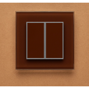 Одноканальный двухклавишный радиопульт DeLUMO Orto 8017 темный коричневый на оранжевой стене