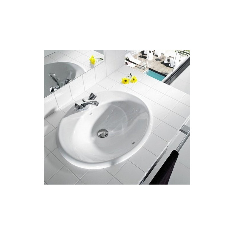 Фото в интерьере умывальника Roca Adora 52x41